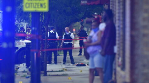 Chicago police investigate a shootout between the Faceworld and Wuga World gang factions that left 15 people wounded in July 2020.