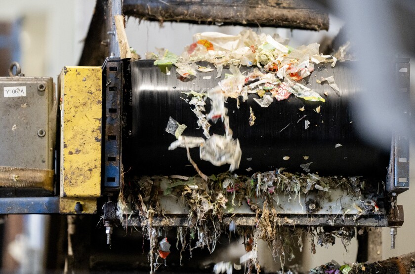 Food waste goes through a hammer mill to separate packaging at Green Era Campus in Auburn Gresham