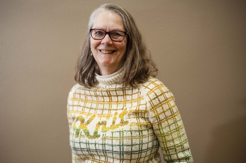 Amy Shirley wears a sweater she knitted that was designed by Anna Johanna during the 19th YarnCon at the Plumbers Union Hall in the Near West Side on Saturday.