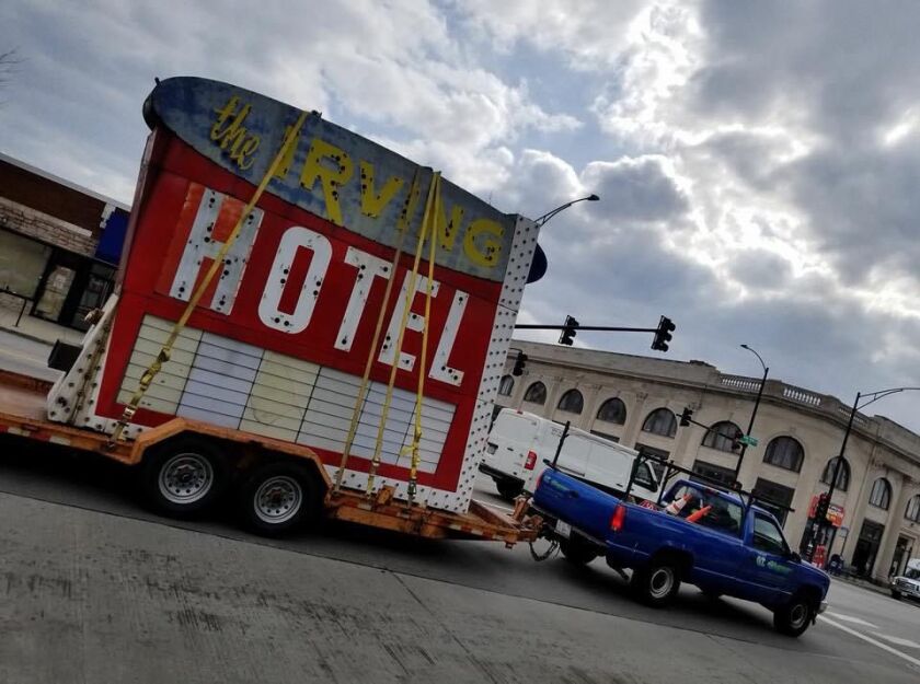 A truck hauls away the Irving Hotel sign. | Photo courtesy of Stephanie Rybandt/Six Corners Association