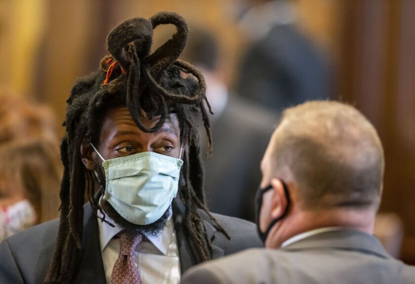 State Sen. Mike Simmons, D-Chicago, left, speaks with state Sen. Patrick Joyce, D-Essex, on the floor of the Illinois Senate in Springfield on Thursday.