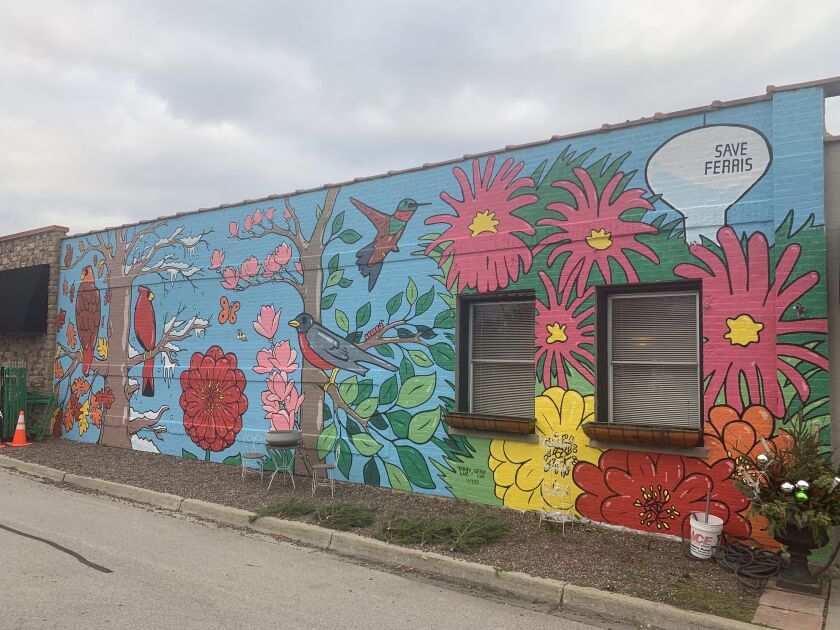 This mural in Northbrook featuring colorful birds and other elements of the outdoors was painted recently by Terry Luc and Gerry Luc.