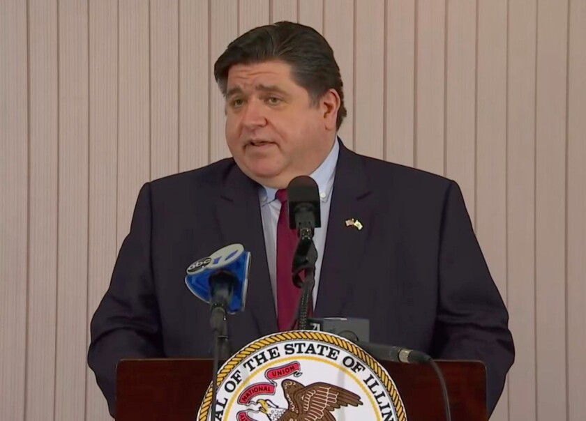 Gov. J.B. Pritzker speaks at an Elgin vaccination site Thursday.