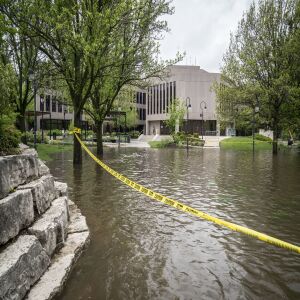 The DuPage River overflowed its banks and flooded portions of the Naperville Riverwalk Monday, May 18, 2020. It worked its way up closer to the Naperville Municipal building.