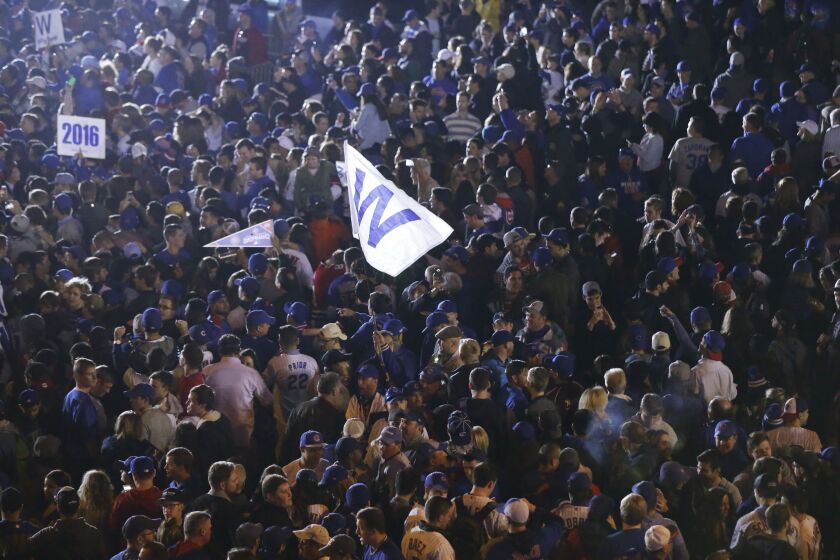 <em>Fans celebrate on the street outside Wrigley Field after Game 6 of the National League baseball championship series between the Cubs and the Los Angeles Dodgers. (AP Photo/Charles Rex Arbogast)</em>