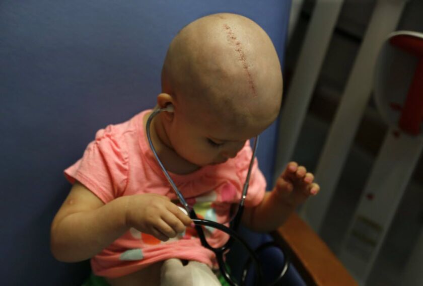 Talia Pisano listens to her heart beat during an examination at Lurie Children’s Hospital. AP photo
