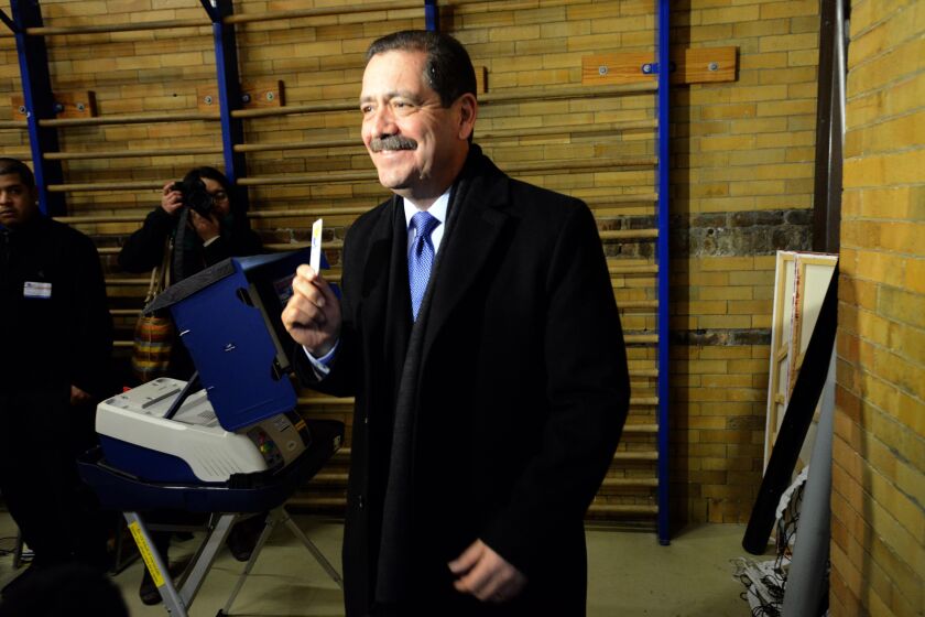 Jesus “Chuy” Garcia holds his electronic card after voting on election day. Tuesday, February 24, 2015 | Brian Jackson/ Sun-Times