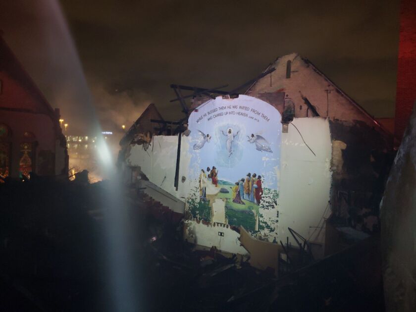 A mural at Antioch Missionary Baptist Church was left untouched by a fire that destroyed the building.