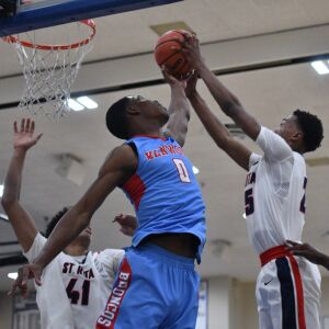 Kenwood’s Seryee Lewis (0) goes up for a rebound. Worsom Robinson/For the Sun-Times.