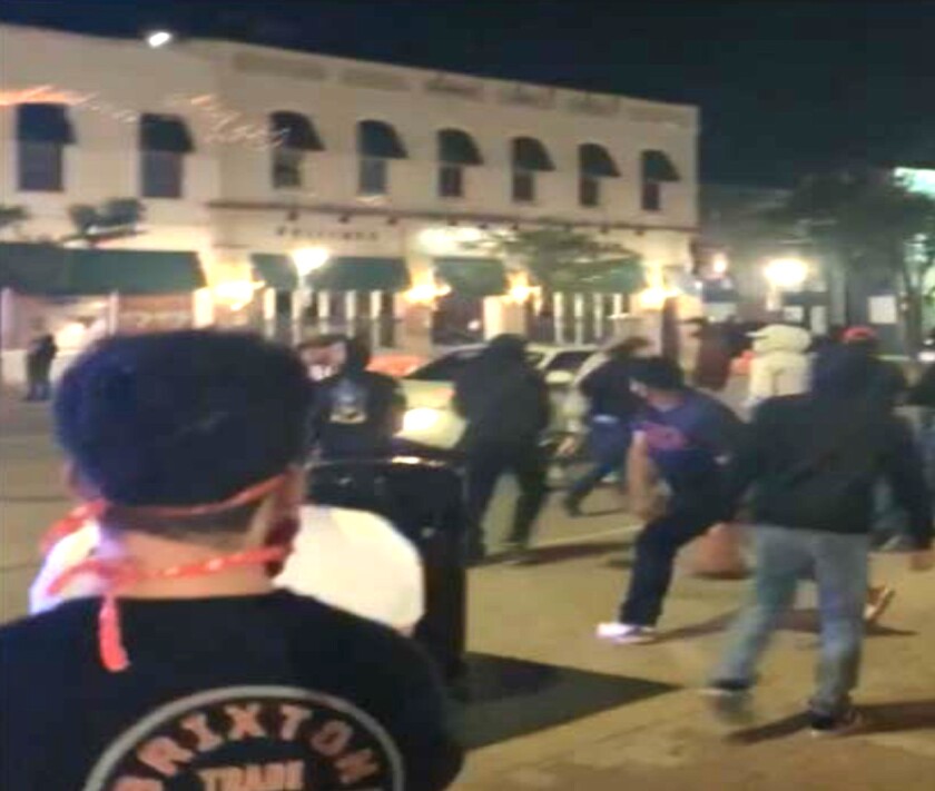 A photo shared with police allegedly shows Christian Rea throwing a firework at Naperville police on June 1, 2020.