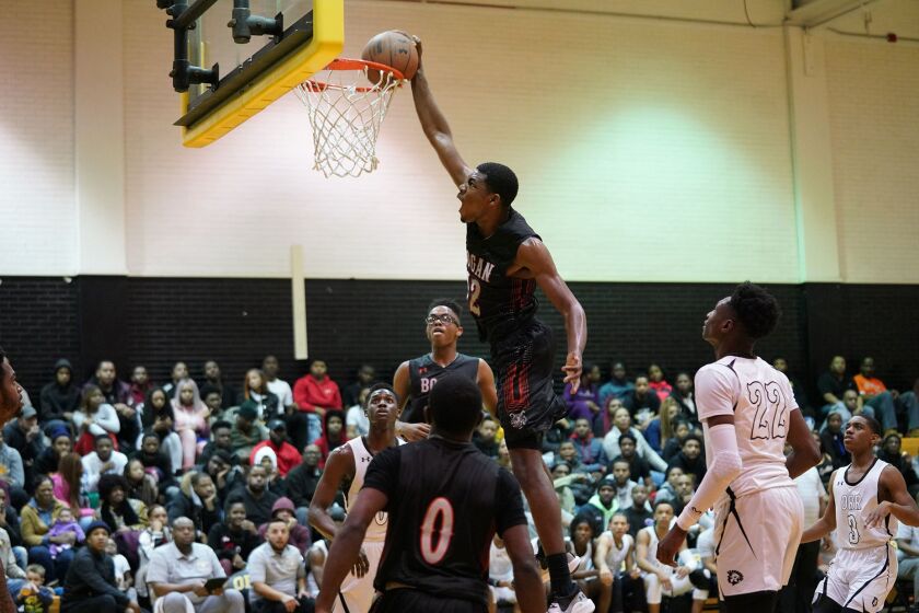 Bogan’s Rashaun Agee (12) gets a dunk in the first half against Orr.