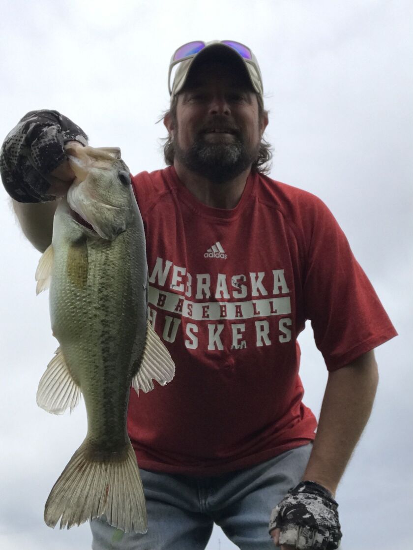 Ken “Husker” O’Malley with a local largemouth bass. Provided photo