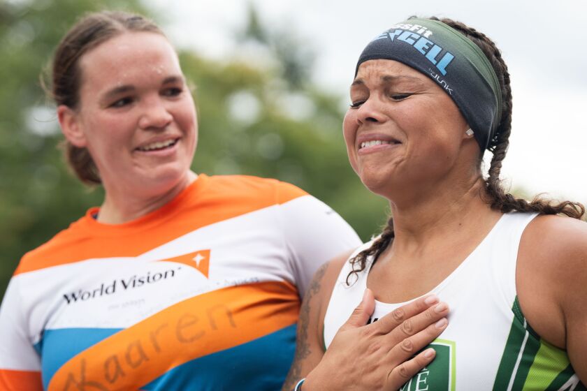 Kaaren Hatlen looks at Kaera Shelby as they react after crossing the finish line of the Bank of America Chicago Marathon at Grant Park, Sunday, Oct. 8, 2023. | Pat Nabong/Sun-Times