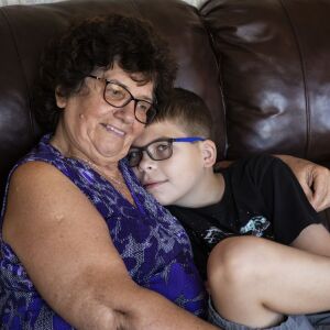 Danuta Kalinowska hugs her 12-year-old grandson Oliwer “Oli” Kluzik at their Northwest Side home.