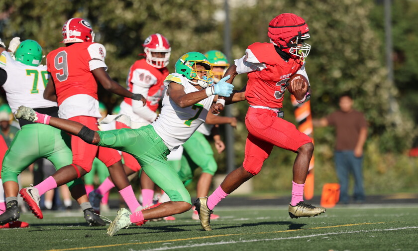Goode's Aedan Cleveland (3) breaks a tackle to score against Ag. Science.