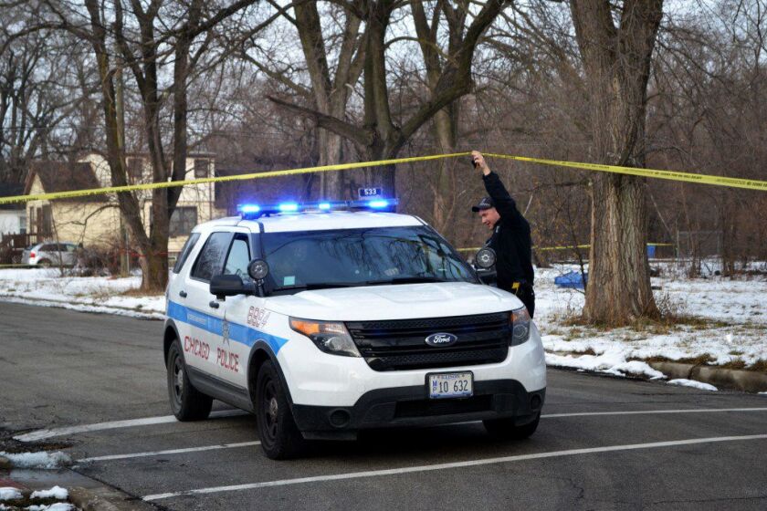 Police investigate a shooting Monday afternoon in the 13300 block of Calumet that critically wounded a 17-year-old boy. | Justin Jackson/Sun-Times