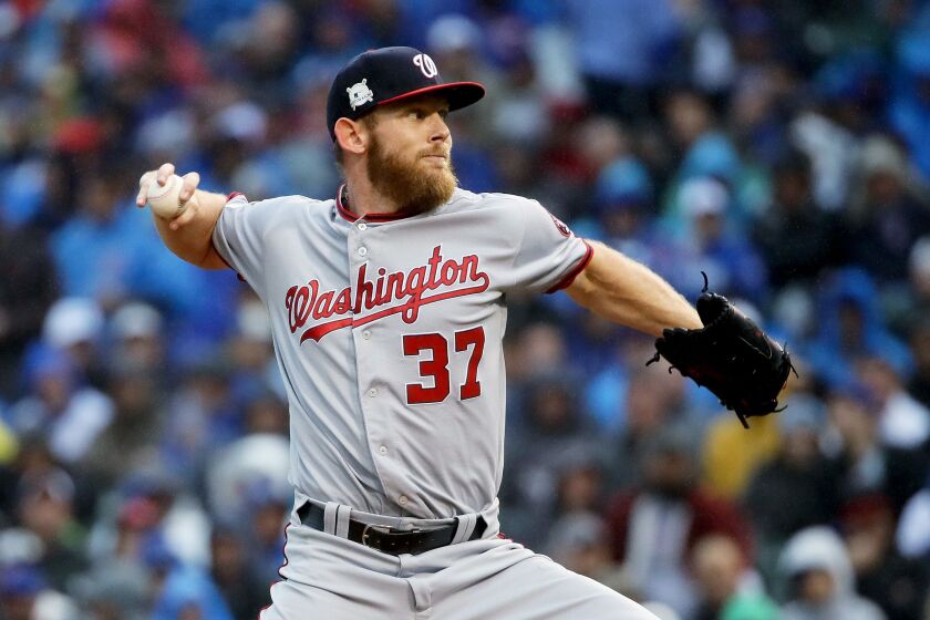 <em>Stephen Strasburg deals. (Photo by Jonathan Daniel/Getty Images)</em>