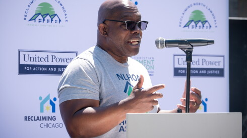Richard Townsell, executive director of the Lawndale Christian Development Corporation, speaks during a ribbon-cutting ceremony for new single family homes in the North Lawndale neighborhood.
