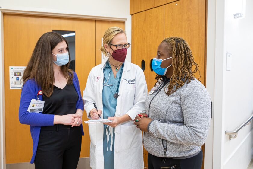 Legal aid attorney Carly Loughran (right), UChicago Medicine trauma surgeon Tanya Zakrison (center), and UChicago Medicine chief violence recovery specialist Christine Goggins on Dec. 1 at the Hyde Park Hospital.