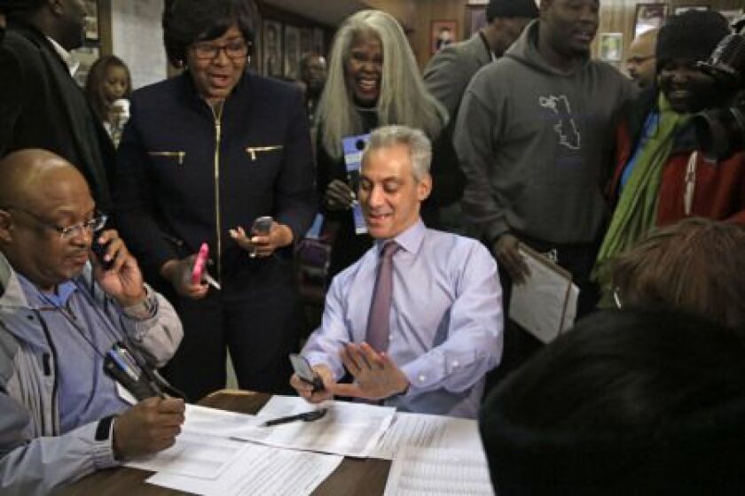 Chicago Mayor Rahm Emanuel joins phone bank workers on election day Tuesday, Feb. 24, 2015, in Chicago. (AP Photo/M. Spencer Green)