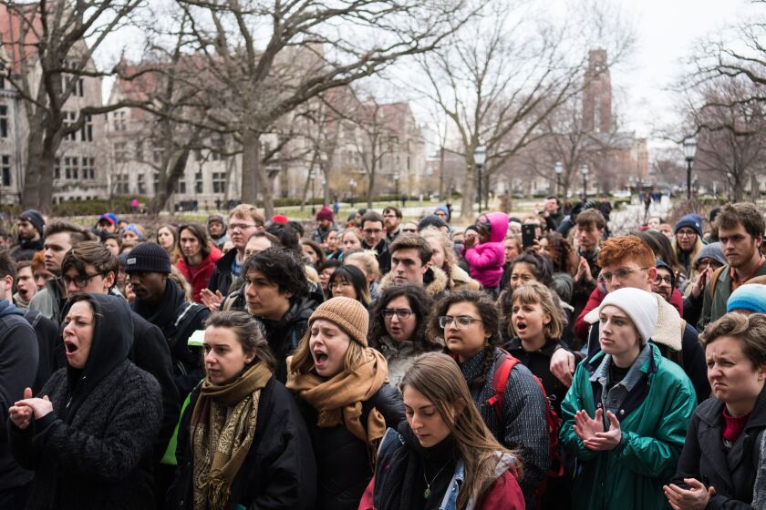 Hyde Park area residents and University of Chicago students rally in protest of the shooting of student Charles Thomas by a University of Chicago Police officer on April 6, 2018.