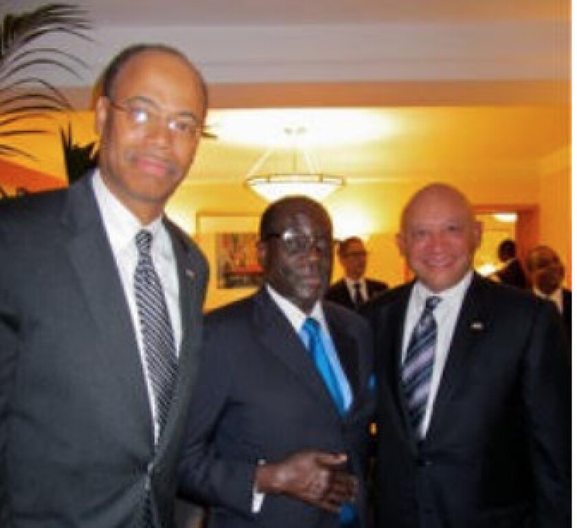 From left, former U.S. Rep. Mel Reynolds, Zimbabwe leader Robert Mugabe and Chicago businessman Elzie Higginbottom in New York City in September 2011. | Supplied photo