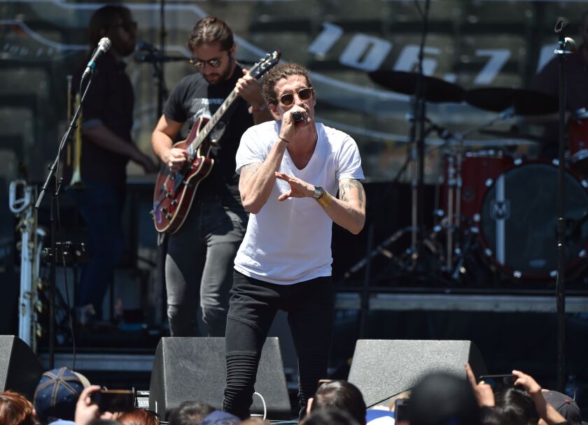 Musicians Zack Feinberg (left) and David Shaw of The Revivalists perform on May 20, 2017, in Carson, California. | Alberto E. Rodriguez/Getty Images
