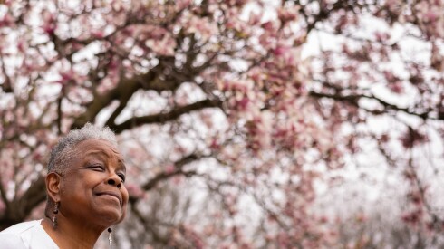 Phyllis Johnson stands under a magnolia tree in her Roseland front yard Monday on Chicago's South Side. In 1994, Johnson co-founded "Women of All Cultures Together (WACT)," an organization for queer women to build community. | Candace Dane Chambers/Sun-Times