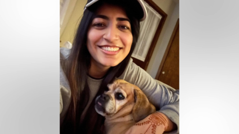 Tameer Siddiqui, of Chicago, poses for a selfie with a puggle named Rosie, which was the subject of an unsuccessful custody fight with an ex-fiance after their relationship ended. Siddiqui helped devise a state law enacted last week by Gov. JB Pritzker that would give new legal rights to unmarried couples to pursue custody of pet dogs, cats and horses.