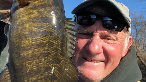 George Peters with a smallmouth bass from cold water on the Kankakee River. Provided photo