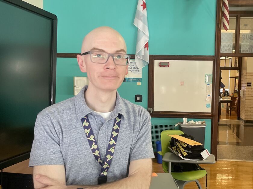 Lane Tech computer science teacher Dan Stone stands in his classroom.