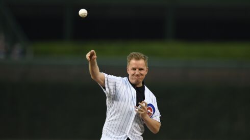 Arlo White throws out a ceremonial first pitch before a Cubs game last season.