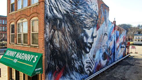 A mural by California artist Christina Angelina in Dubuque called “Justice.”