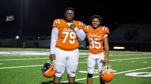 Young’s Mason Abdul-Ameen (35) poses for a photos with Odurose Acheampong (79) after winning the game against Phillips at Rockne Stadium.