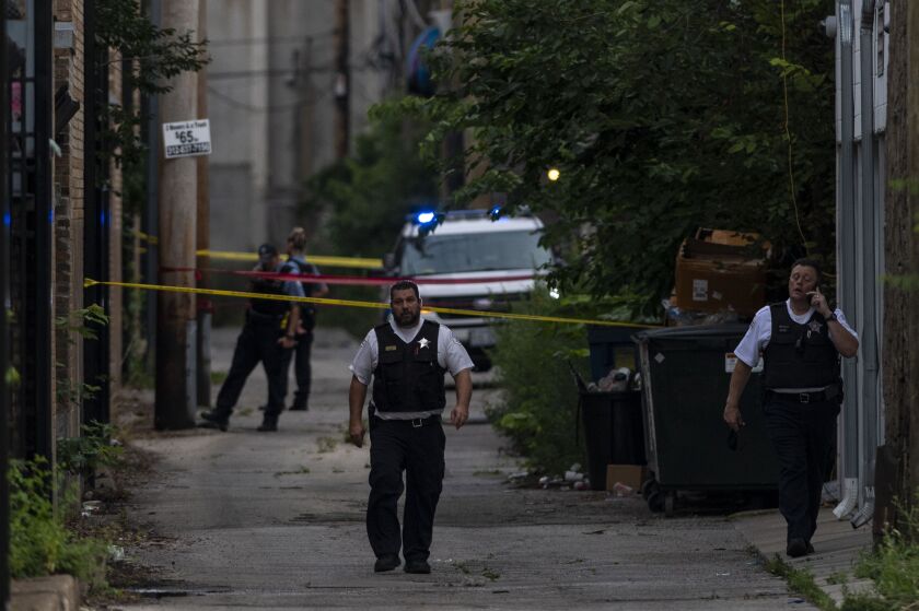 Chicago police investigate the scene where a 9-year-old boy was shot and killed in the 900 block of North Cambridge earlier this month.