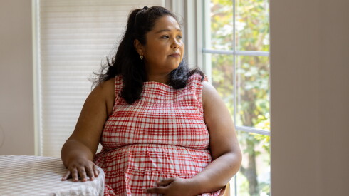 Eleanor Grano sits in the kitchen of her Riverside home on Sept. 15, 2026. Grano has spent nearly her entire pregnancy trying to access doula benefits.