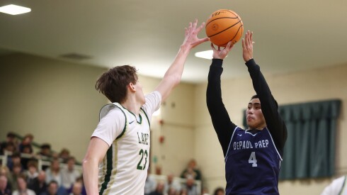 DePaul Prep’s Rykan Woo (4) shoots the ball against Lane’s Matt Szafoni (23) at the Battle of the Bridge tournament.