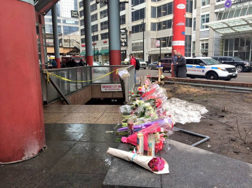 A makeshift memorial of flowers, candles and a cross with CPD Cmdr. Paul Bauer’s name and photo near where he was fatally shot Tuesday. | Sam Charles/Sun-Times