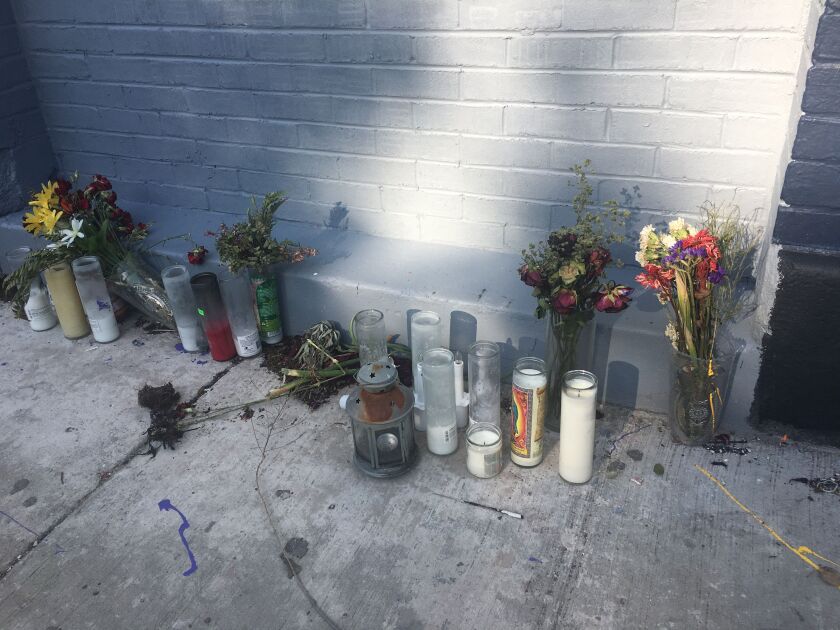 Pilsen residents held a vigil last Tuesday to mourn the loss of the historic Casa Aztlan mural. | Amanda Svachula