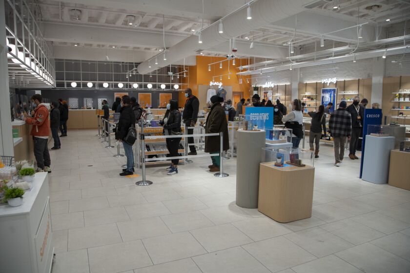 Customers shop just after the ribbon cutting for Sunnyside Wrigleyville marijuana dispensary. Monday, November 15, 2021.
