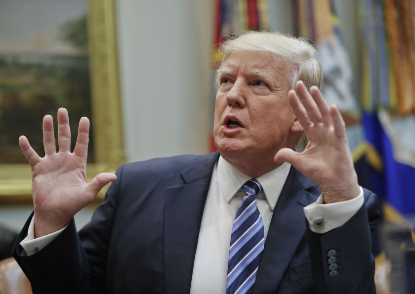 President Donald Trump gestures while speaking during a meeting on healthcare in the Roosevelt Room of the White House on Monday. | Pablo Martinez Monsivais/Associated Press