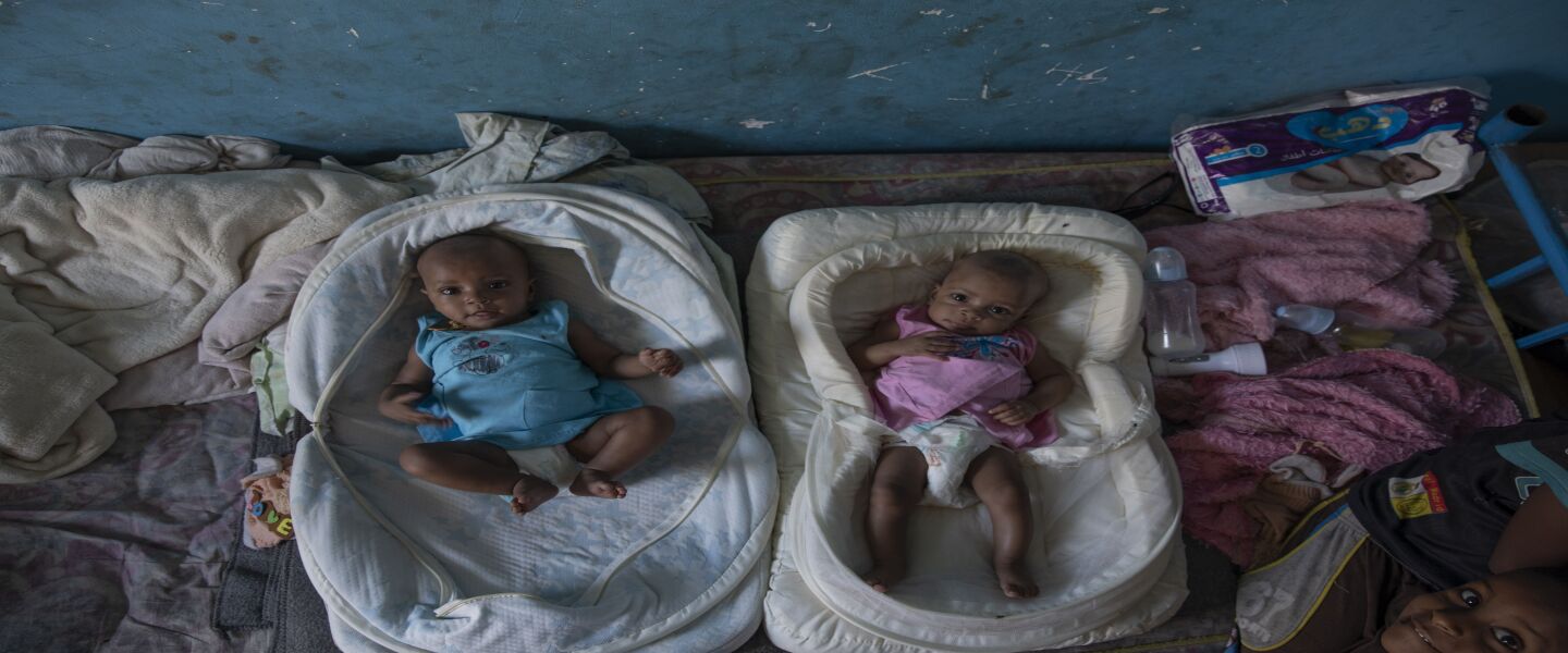 Tigrayan 4-month-old twin sisters Aden (left) and Turfu Gebremariam inside their family’s shelter in Hamdayet in eastern Sudan, near the border with Ethiopia. In the fear and despair of the days following their birth, the twins were left unnamed. There simply was no time. Finally, their young brother Micheale christened them himself. One of the girls was named Aden, or “paradise.” The other, who reminds people of her mother, was named Turfu, or “left behind.”