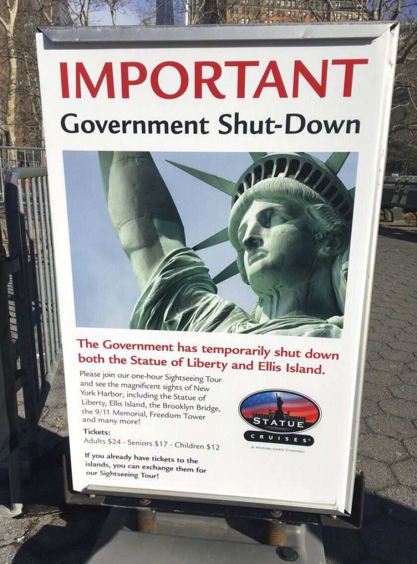 This sign at the Ellis Island ferry tells visitors there is no access on Saturday to the island or to the Statue of Liberty due to the government shutdown. The National Park Service cited “a lapse in appropriations” as it turned away visitors. | Ted Shaff