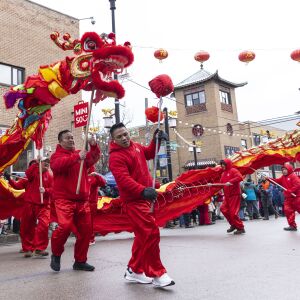 Performers as a Chinese dragon make their way down the street during the Lunar New Year Celebration Parade in Chinatown, Sunday, Jan. 29, 2023.