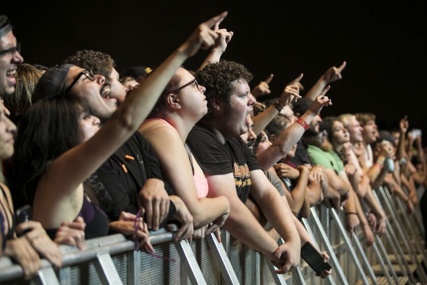 Fans cheer as Queens of the Stone Age performs on day two of Riot Fest in Douglas Park, Sept. 16, 2017. | Ashlee Rezin/Sun-Times