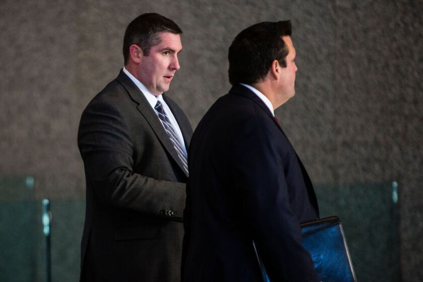 Chicago Police Officer Patrick Kelly (left) enters the Dirksen Federal Courthouse. | James Foster/For the Sun-Times