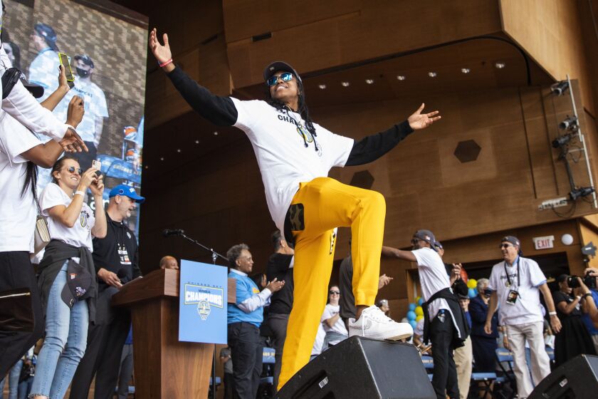 Diamond DeShields poses as the Chicago Sky players celebrate their WNBA Championship title at Pritzker Pavilion.
