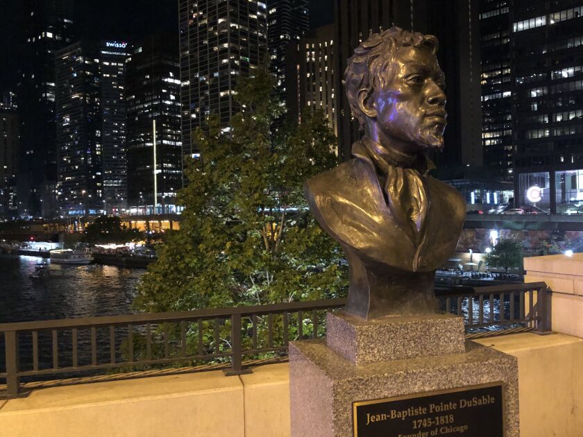 A bust of Jean Baptiste Point DuSable stands along Michigan Avenue in Chicago.