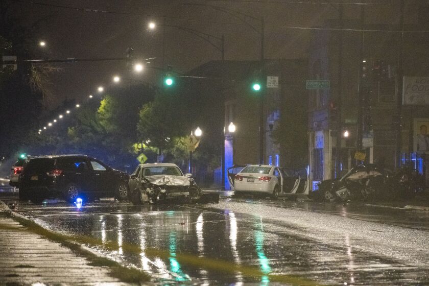 Chicago police investigate the scene of a fatal car accident Monday night in the 6900 block of South Loomis. | Tyler LaRiviere/Sun-Times