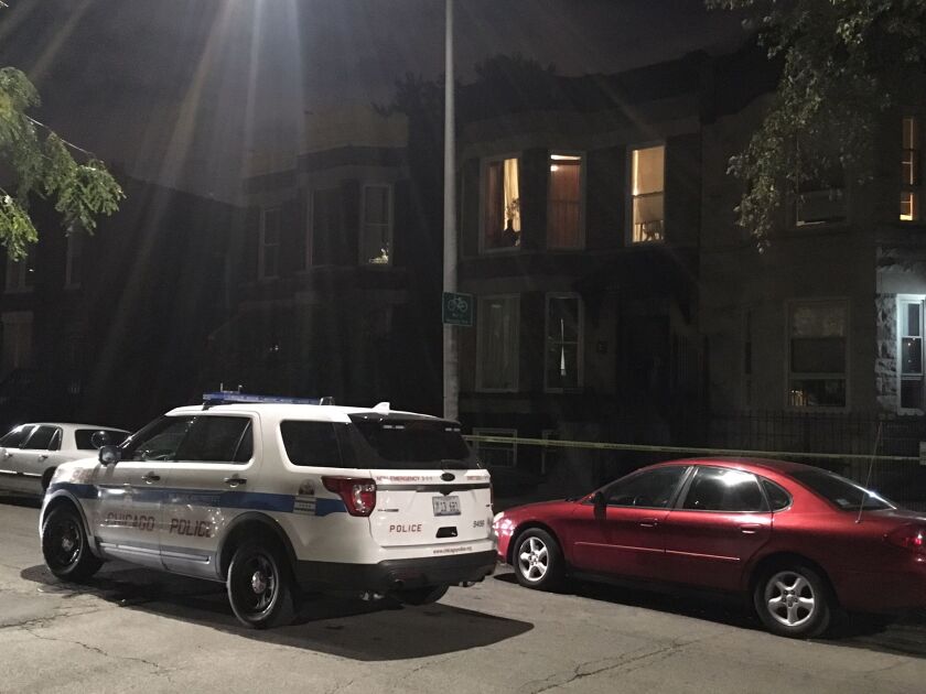 A police car is seen in the 6600 block of South Marquette on Sunday evening, where a 16-year-old girl was accidentally shot to death by an acquaintance, Chicago Police said. | Jon Seidel/Chicago Sun-Times